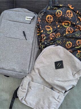 DSW Gray Casual Backpacks with Black and Orange Peace Print Accent